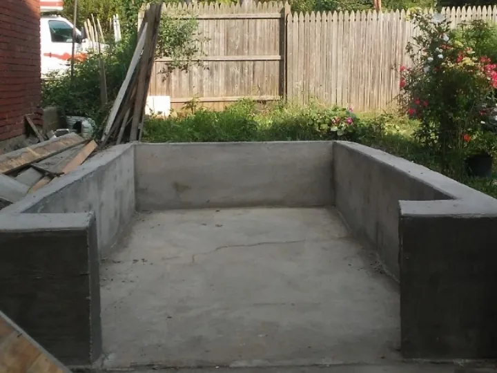 Block wall enclosure finished with a smooth parge coat
