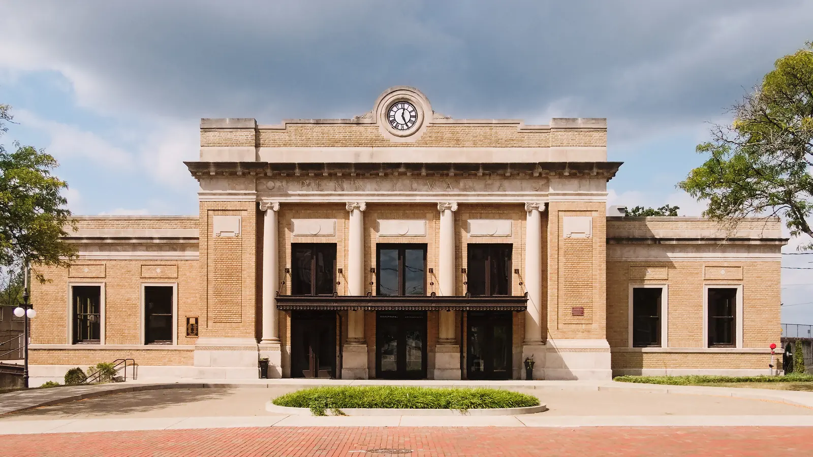 Wilkinsburg, PA landmark: the restored Wilkinsburg train station, a tan brick building with columns and a clock above the entrance